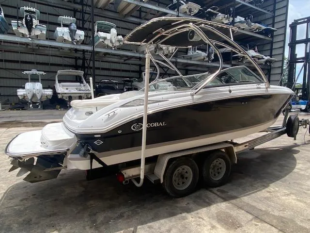 Slide: The Image of 2008 Cobalt 222 boat on a trailer in a storage facility. - 6