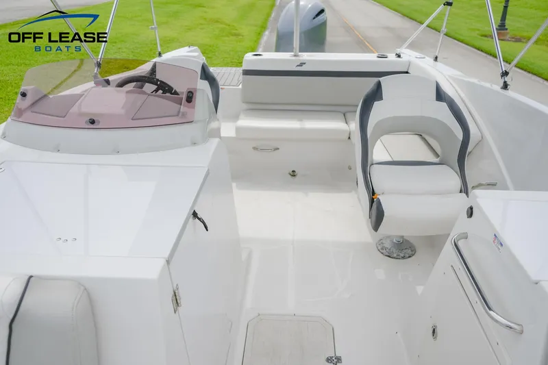 Slide: The Image of 2022 Starcraft SVX 231 OB boat interior with white and gray seating. - 5