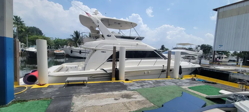 The Image of 2004 Sea Ray 480 Sedan Bridge yacht docked at marina. - 0