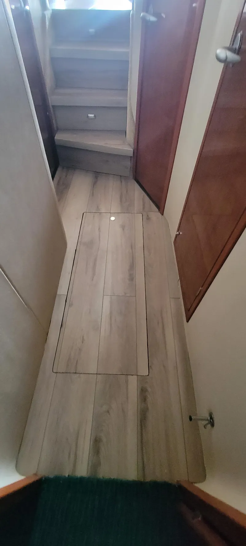 Slide: The Image of Interior hallway of a 2004 Sea Ray 480 Sedan Bridge yacht with wooden flooring. - 38