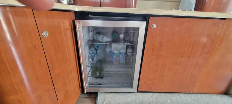 Slide: The Image of Mini fridge in 2004 Sea Ray 480 Sedan Bridge yacht kitchen. - 41