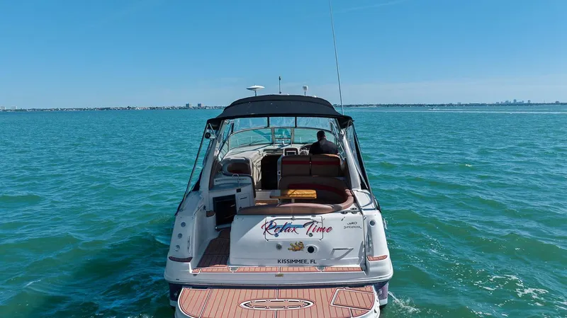 Slide: The Image of 2006 Sea Ray 320 Sundancer boat cruising on open water. - 18