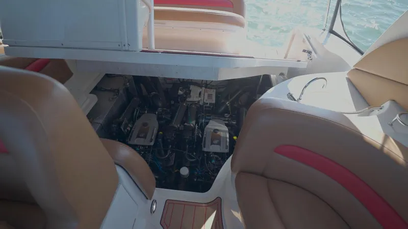 Slide: The Image of Engine compartment of a 2006 Sea Ray 320 Sundancer boat with open hatch. - 35