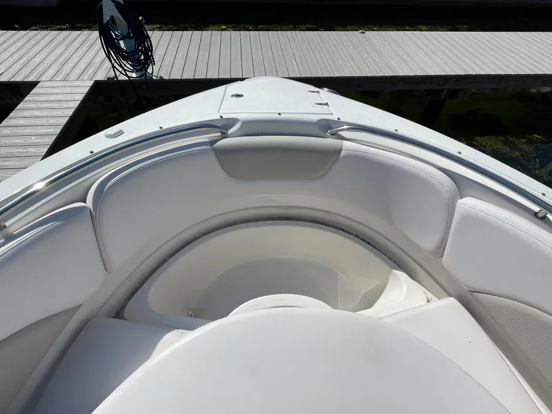 Slide: The Image of Bow seating area of a 2009 Chaparral 276 SSX boat at a dock. - 18