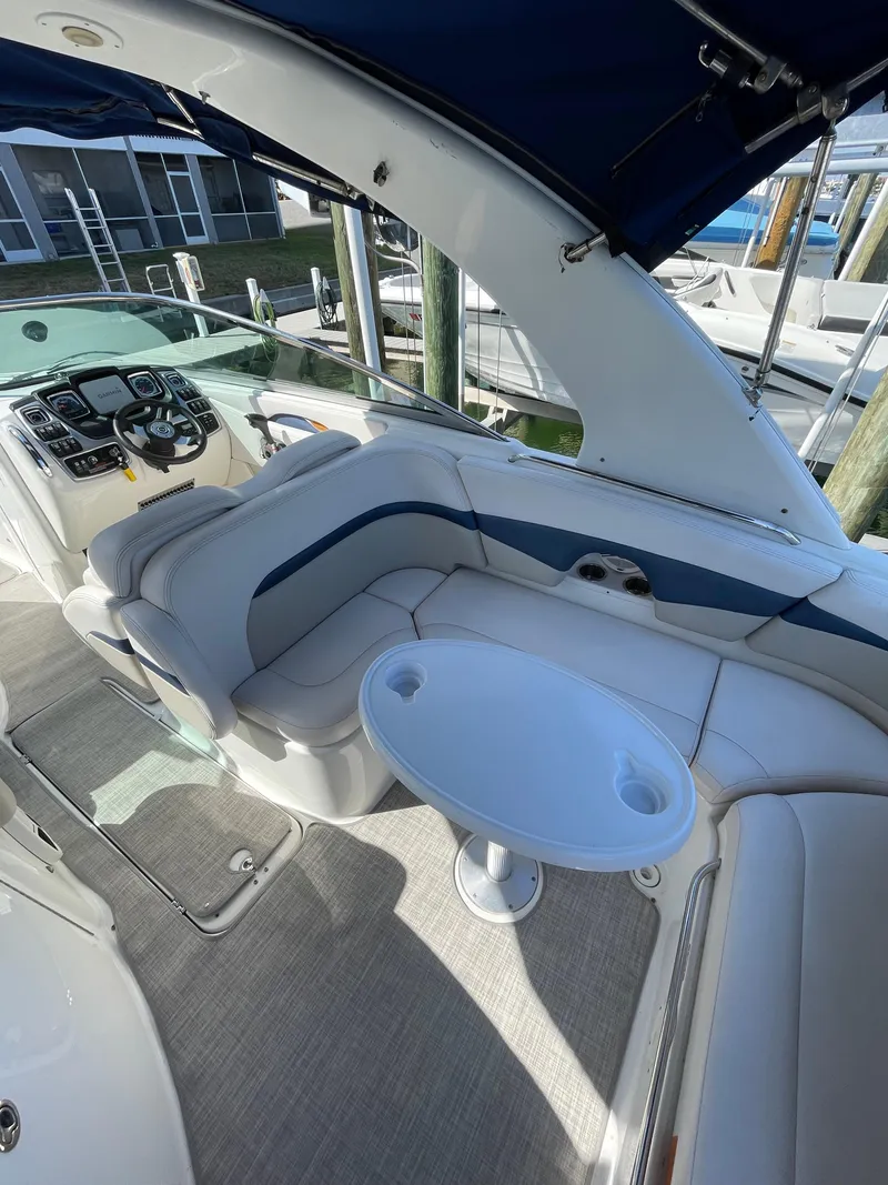 Slide: The Image of 2009 Chaparral 276 SSX boat interior with seating and table. - 22