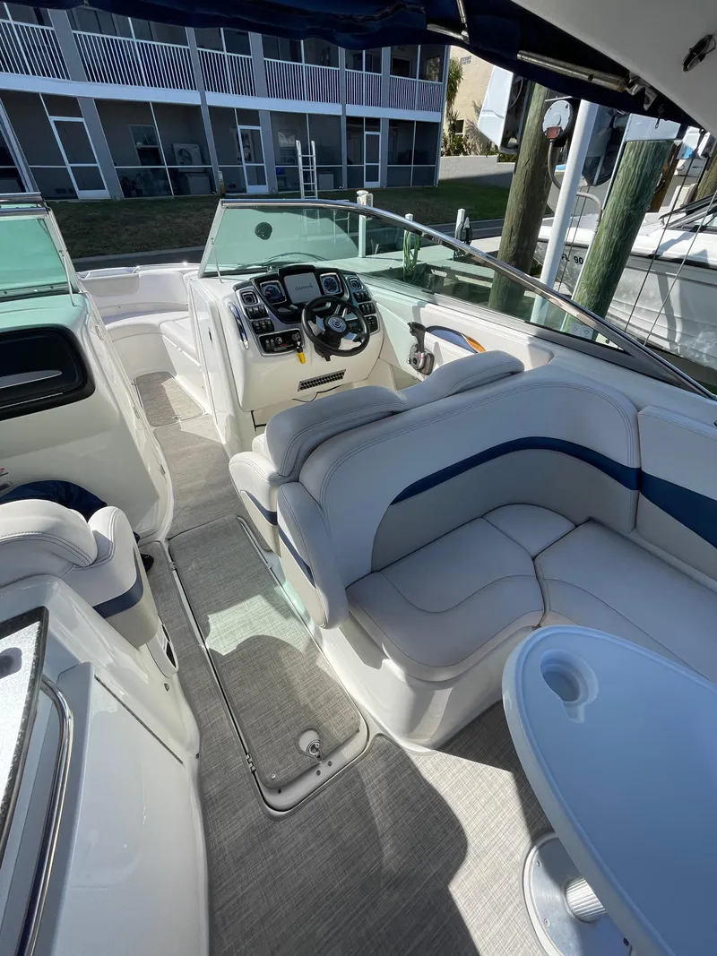 Slide: The Image of 2009 Chaparral 276 SSX boat interior with helm and seating area. - 23