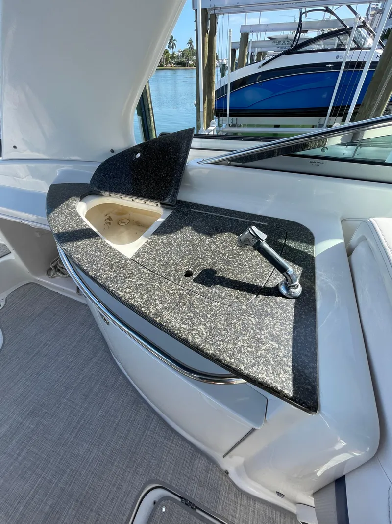 Slide: The Image of 2009 Chaparral 276 SSX boat interior with sink and faucet. - 24