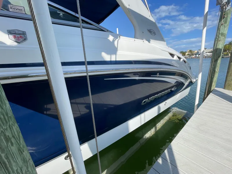 Slide: The Image of 2009 Chaparral 276 SSX boat docked on a sunny day. - 32