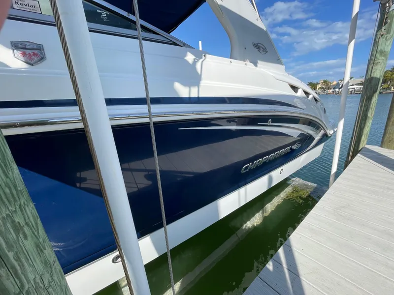Slide: The Image of 2009 Chaparral 276 SSX boat docked on a sunny day. - 33