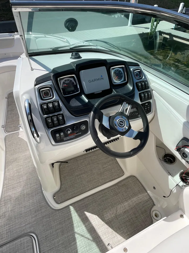 Slide: The Image of 2009 Chaparral 276 SSX boat cockpit with Garmin navigation system and modern controls. - 36