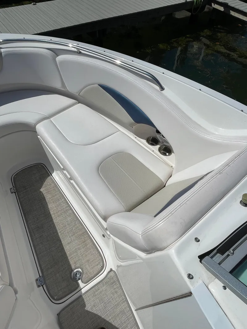 Slide: The Image of 2009 Chaparral 276 SSX boat interior seating area with cup holders. - 38
