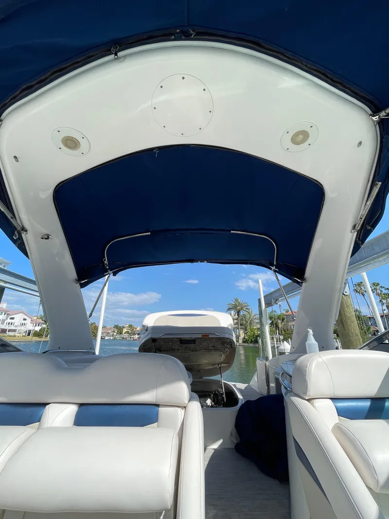 Slide: The Image of Interior view of a 2009 Chaparral 276 SSX boat with blue canopy. - 8