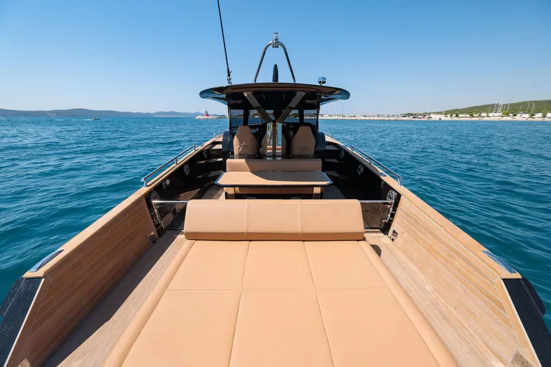 Slide: The Image of 2025 Focus Forza 37 luxury yacht on open sea, featuring spacious deck and modern design. - 16