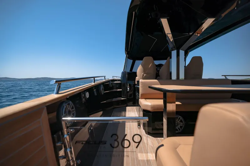 Slide: The Image of Luxurious 2025 Focus Forza 37 yacht interior with elegant seating and ocean view. - 17
