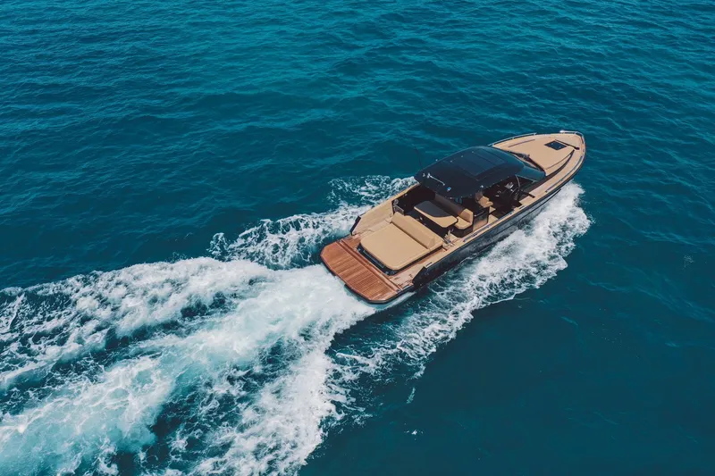 Slide: The Image of 2025 Focus Forza 37 yacht cruising on open blue sea. - 2