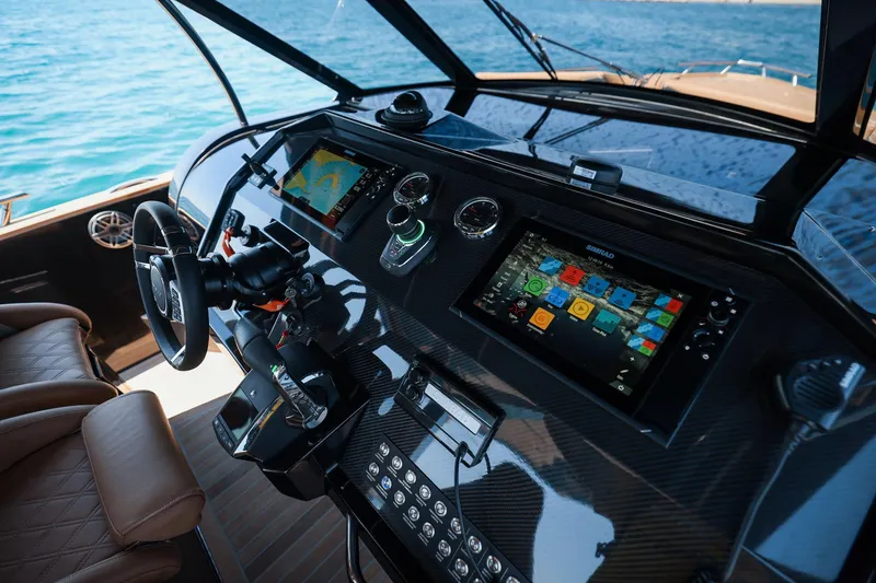 Slide: The Image of Cockpit of 2025 Focus Forza 37 yacht with advanced navigation systems and luxurious seating. - 20