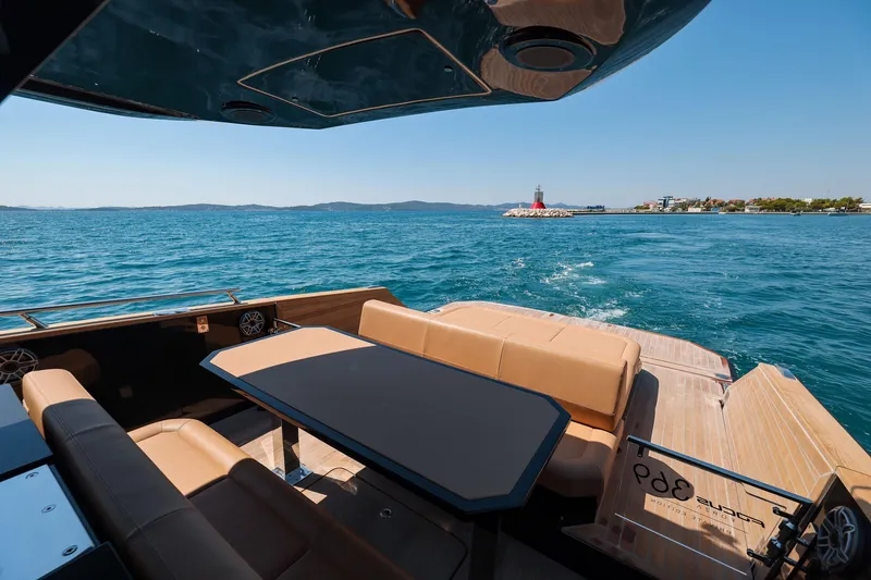 Slide: The Image of Luxury seating area on 2025 Focus Forza 37 yacht, overlooking serene ocean view. - 25