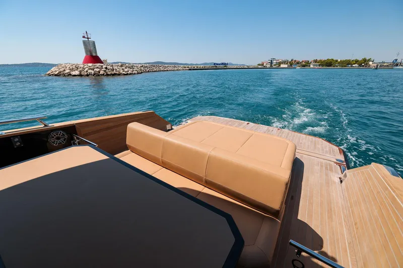 Slide: The Image of 2025 Focus Forza 37 yacht cruising near a lighthouse on a sunny day. - 26