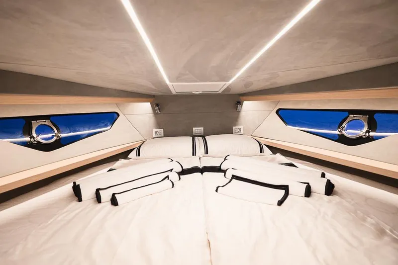 Slide: The Image of Luxurious interior of 2025 Focus Forza 37 yacht with elegant bedding and modern lighting. - 38