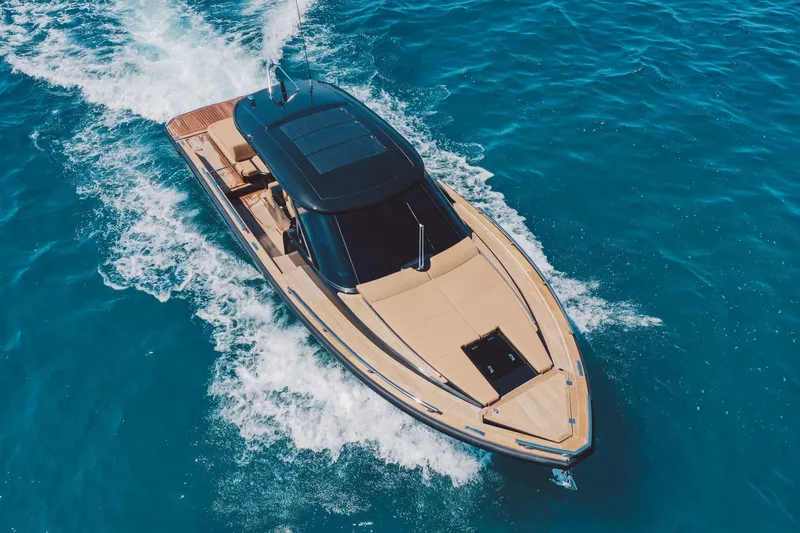 Slide: The Image of Luxury Focus Forza 37 yacht cruising on clear blue water, 2025 model. - 5