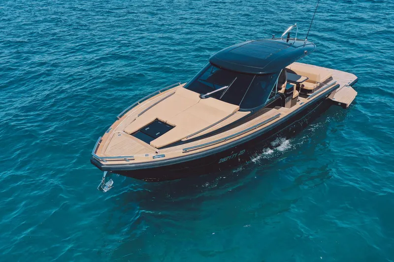 Slide: The Image of 2025 Focus Forza 37 luxury boat cruising on clear blue water. - 6