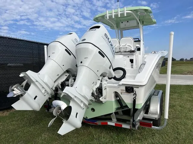 Slide: The Image of 2024 Sea Pro 259 Sport boat with dual Suzuki outboard motors on trailer. - 3