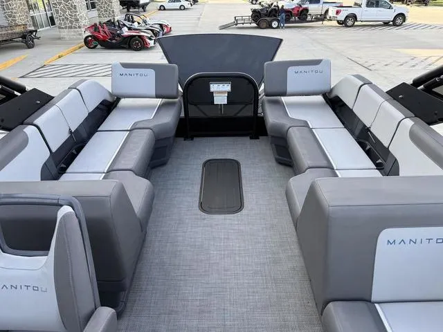 Slide: The Image of 2024 Manitou Cruise 22 Max Bench V-Toon interior with spacious seating and modern design. - 6