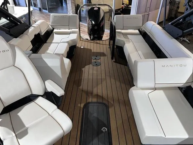 Slide: The Image of 2024 Manitou Explore 26 Switchback Single Engine V-Toon interior with luxurious seating. - 11