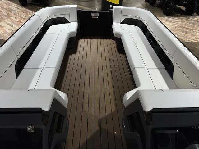 Slide: The Image of 2024 Manitou Explore 26 Switchback Single Engine V-Toon interior with spacious seating. - 6