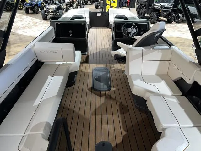 Slide: The Image of 2024 Manitou Explore 26 Switchback Single Engine V-Toon interior with luxurious seating and modern design. - 9
