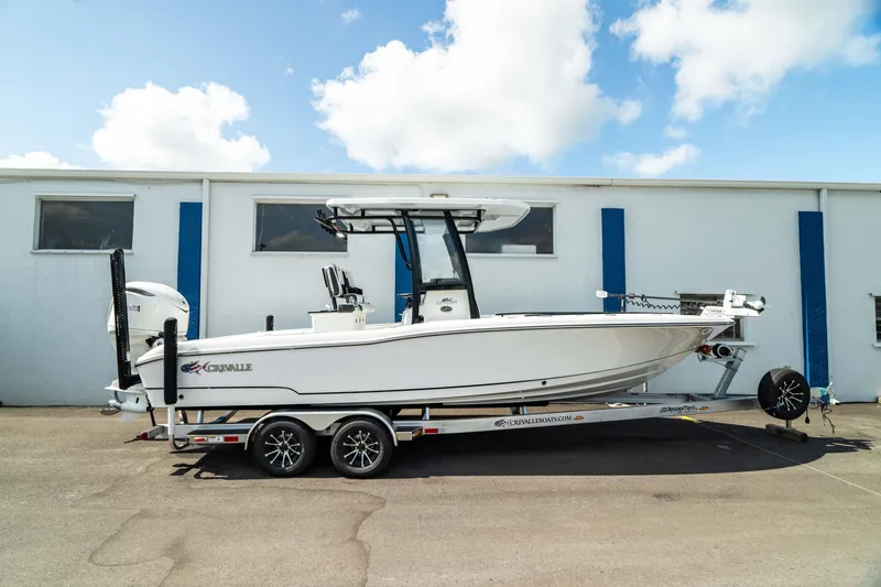 The Image of 2025 Crevalle 26 HBW boat on a trailer, parked outdoors. - 0