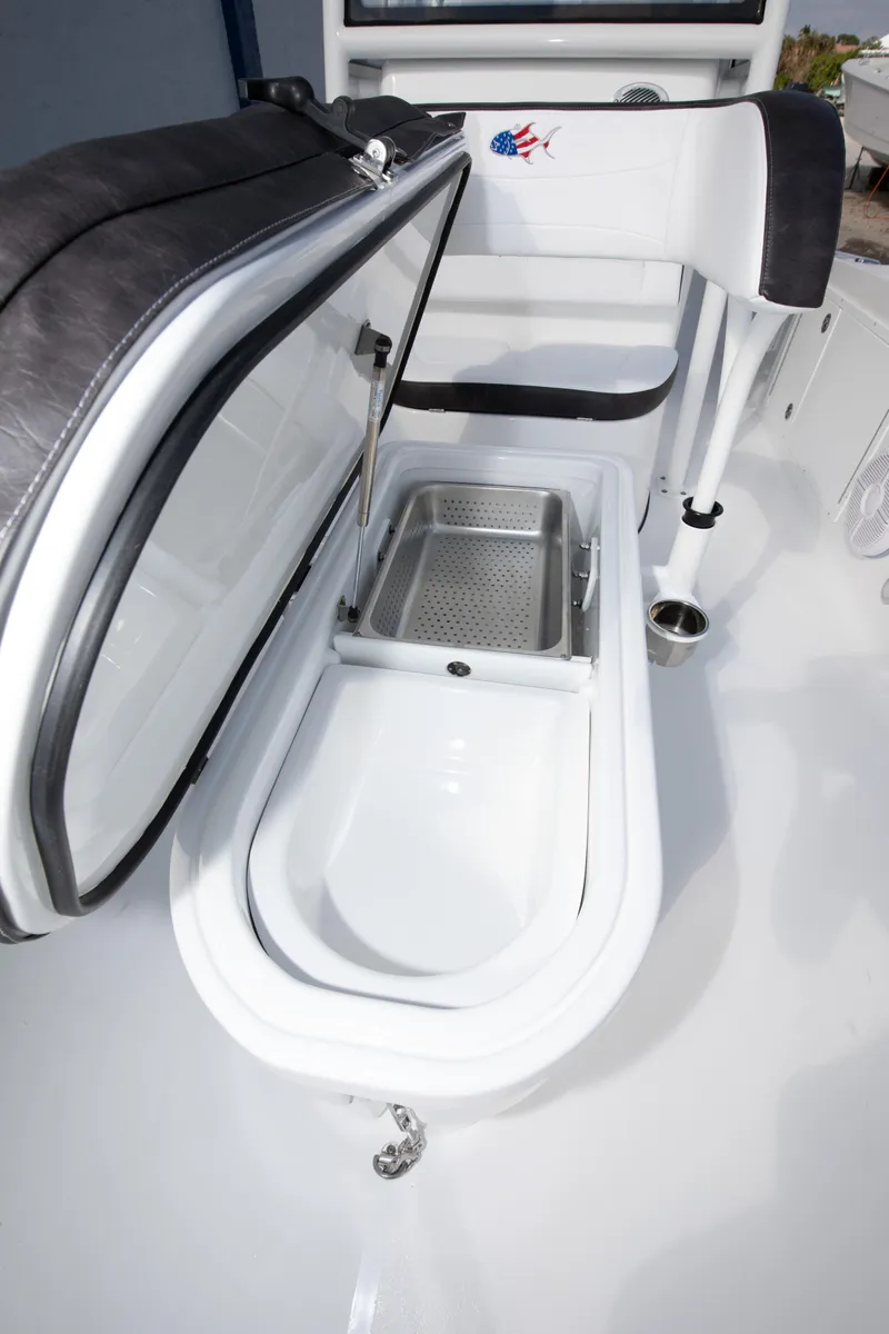 Slide: The Image of 2025 Crevalle 26 HBW boat with open storage compartment. - 22
