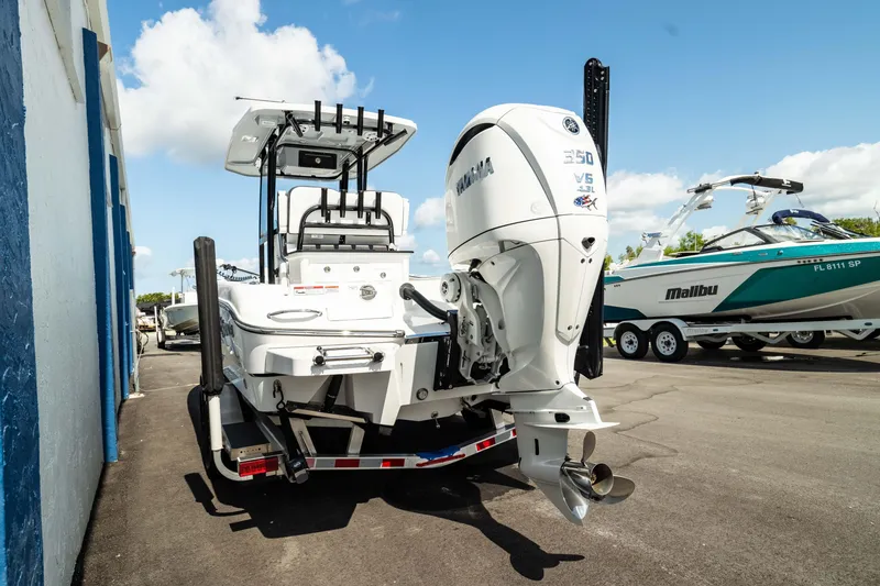 Slide: The Image of 2025 Crevalle 26 HBW boat with Yamaha 350 V8 engine, docked outdoors. - 3