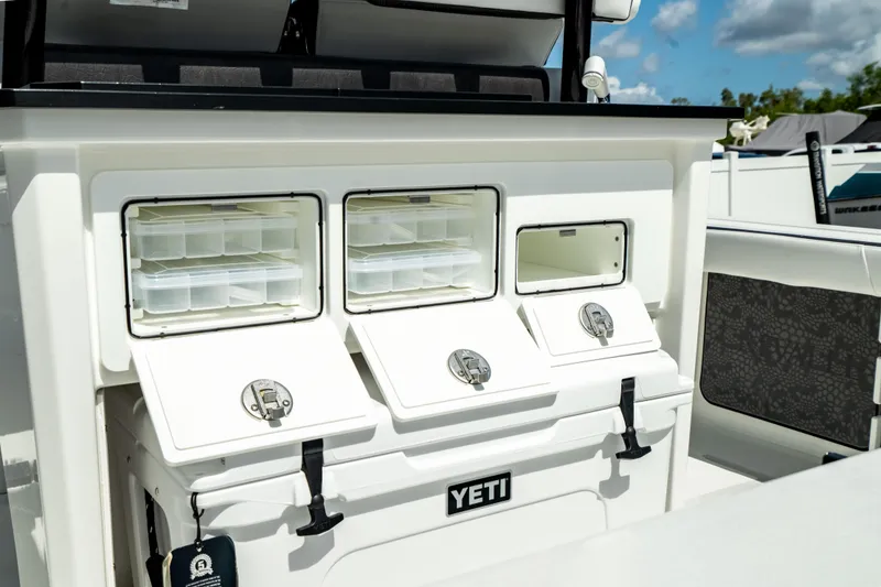 Slide: The Image of Crevalle 26 HBW 2025 boat with Yeti cooler and storage compartments. - 30