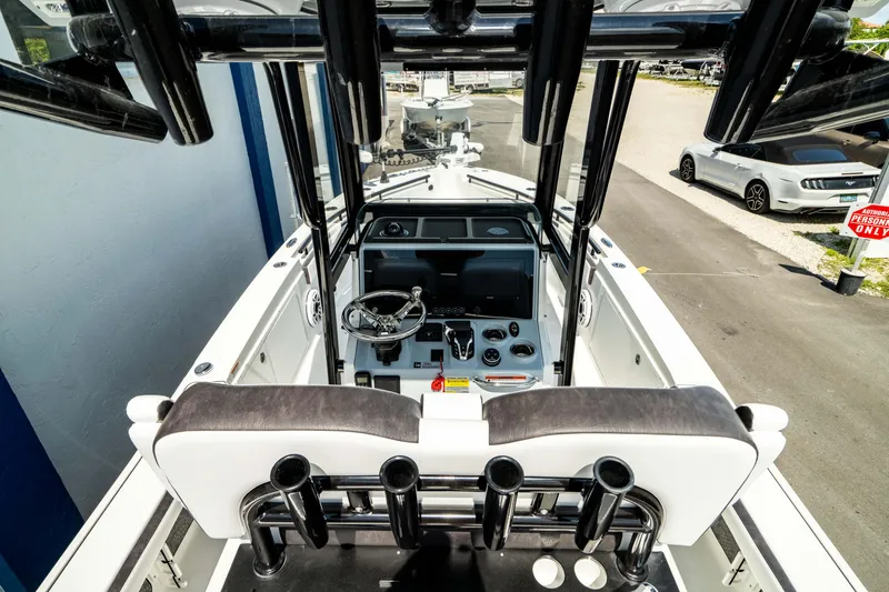 Slide: The Image of 2025 Crevalle 26 HBW boat cockpit with steering wheel and control panel. - 31