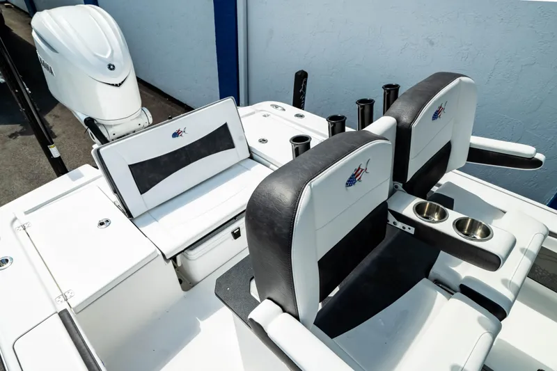 Slide: The Image of 2025 Crevalle 26 HBW boat interior with seating and cup holders. - 33