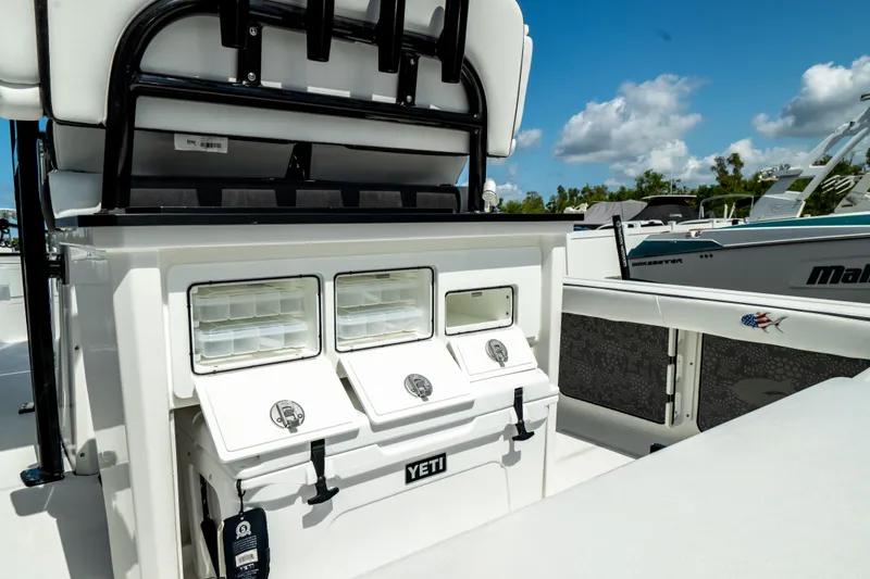 Slide: The Image of 2025 Crevalle 26 HBW boat with Yeti cooler and storage compartments. - 8