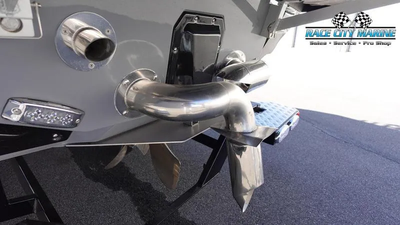 Slide: The Image of 2021 Nautique Super Air Nautique G25 boat stern with propeller and exhaust system. - 10