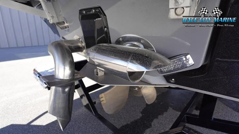 Slide: The Image of 2021 Nautique Super Air Nautique G25 boat propeller and exhaust system close-up. - 11