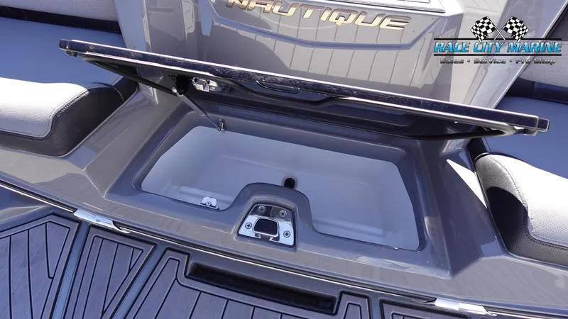 Slide: The Image of 2021 Nautique Super Air Nautique G25 storage compartment, Race City Marine branding. - 15