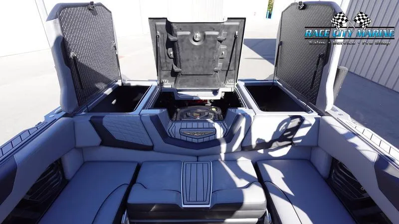 Slide: The Image of 2021 Nautique Super Air Nautique G25 interior with open storage compartments. - 18