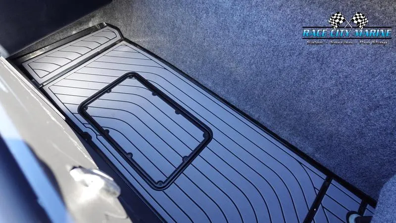 Slide: The Image of 2021 Nautique Super Air Nautique G25 storage compartment with custom flooring. - 20