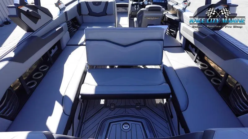 Slide: The Image of 2021 Nautique Super Air Nautique G25 interior with luxurious seating and modern design. - 21