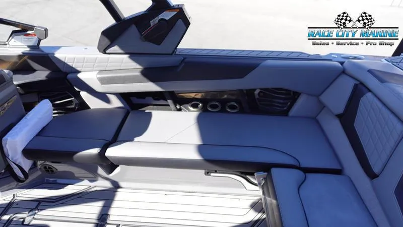 Slide: The Image of 2021 Nautique Super Air Nautique G25 interior seating with Race City Marine logo. - 22