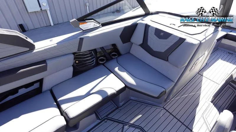 Slide: The Image of 2021 Nautique Super Air Nautique G25 interior with sleek gray seating and modern design. - 29