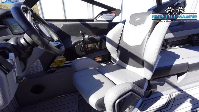 Slide: The Image of 2021 Nautique Super Air Nautique G25 interior with modern steering and seating. - 33