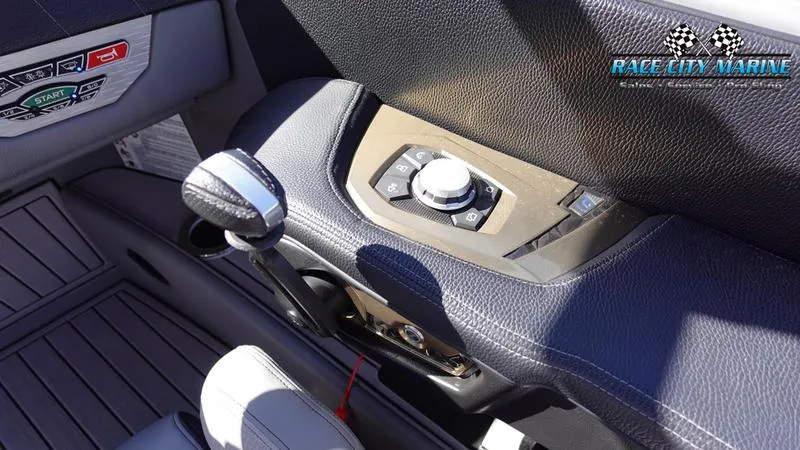 Slide: The Image of 2021 Nautique Super Air Nautique G25 boat interior control panel and throttle. - 34
