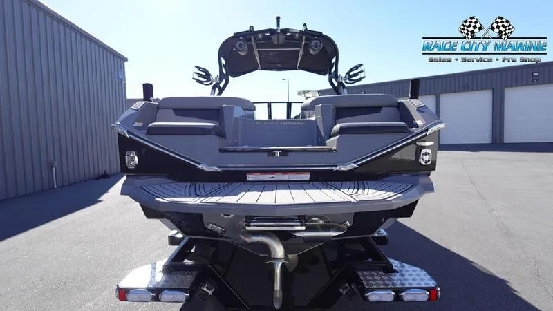 Slide: The Image of 2021 Nautique Super Air Nautique G25 boat rear view at Race City Marine. - 4