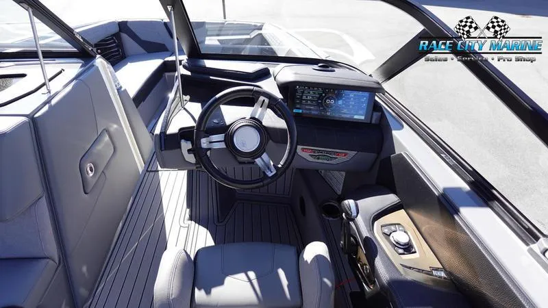 Slide: The Image of 2021 Nautique Super Air Nautique G25 cockpit with modern steering and dashboard. - 41