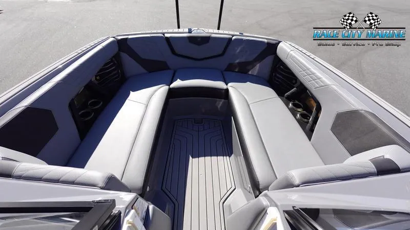 Slide: The Image of 2021 Nautique Super Air Nautique G25 boat interior with spacious seating and sleek design. - 42